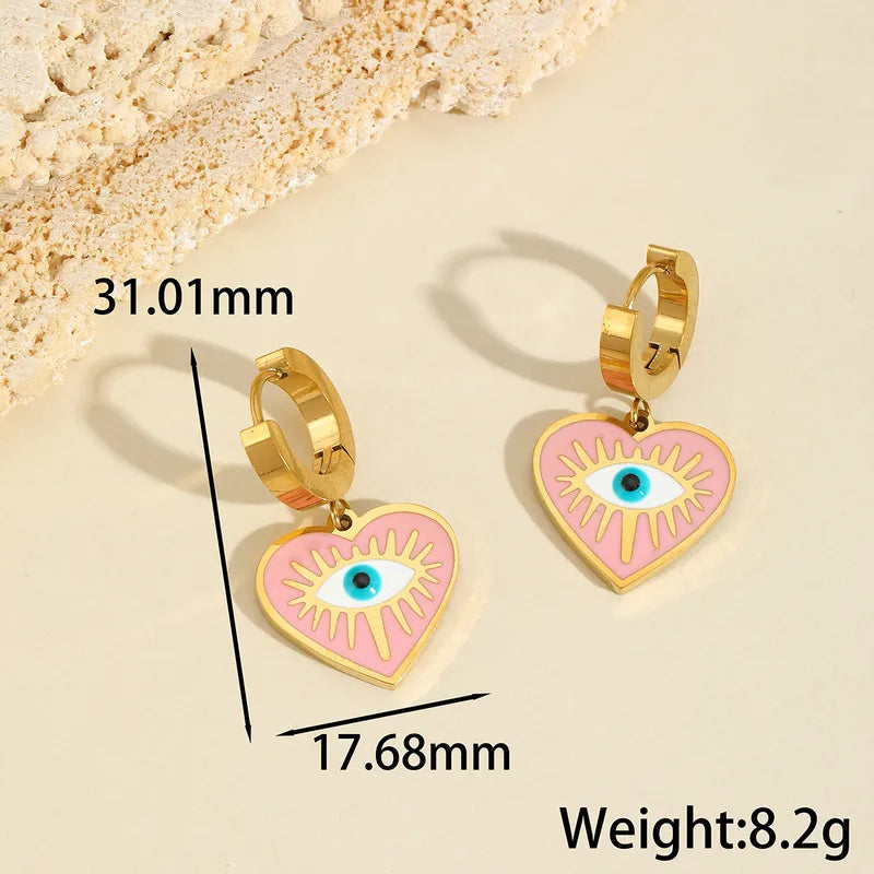 Aretes multiples dijes ojo turco