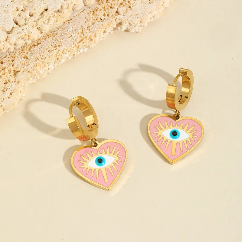 Aretes multiples dijes ojo turco